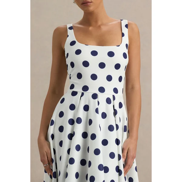 Berta | Robe mi-longue blanche à pois bleu marine et encolure carrée
