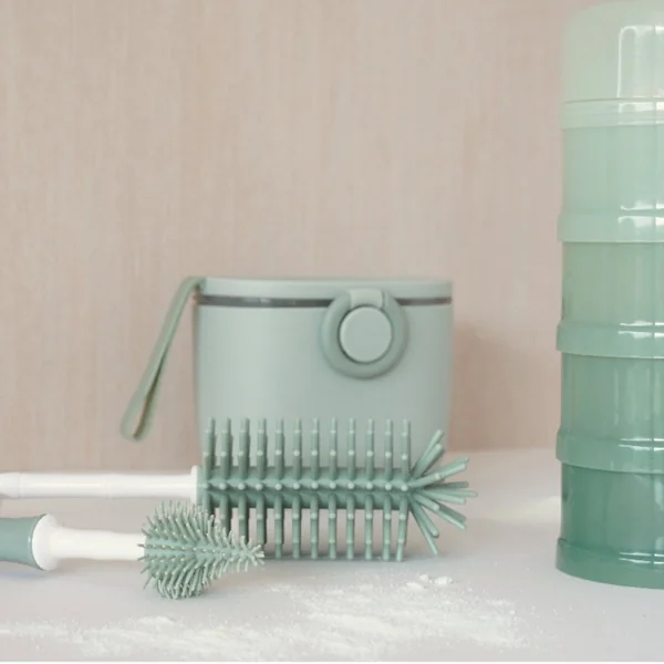 Bottle brush with teat rinser
