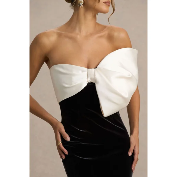 Divulge | Robe longue noire et blanche en velours à encolure asymétrique avec détail nœud