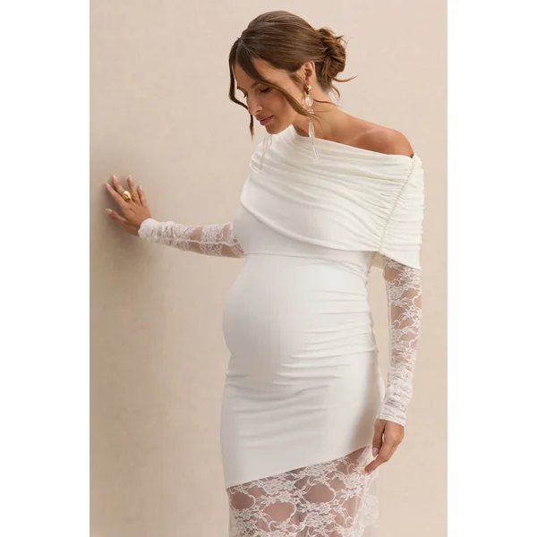 Giuliana | Robe longue de grossesse blanche à encolure asymétrique avec détails en dentelle