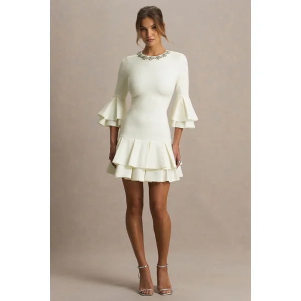 Mirna | Mini-robe crème à encolure ras-du-cou avec manches évasées et détails volantés
