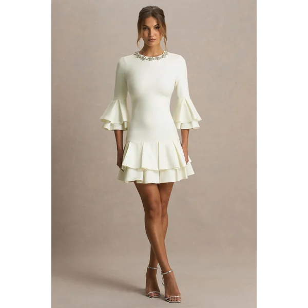 Mirna | Mini-robe crème à encolure ras-du-cou avec manches évasées et détails volantés