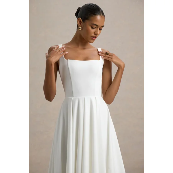 Parina | Robe mi-longue blanche à bretelles et ourlet volumineux