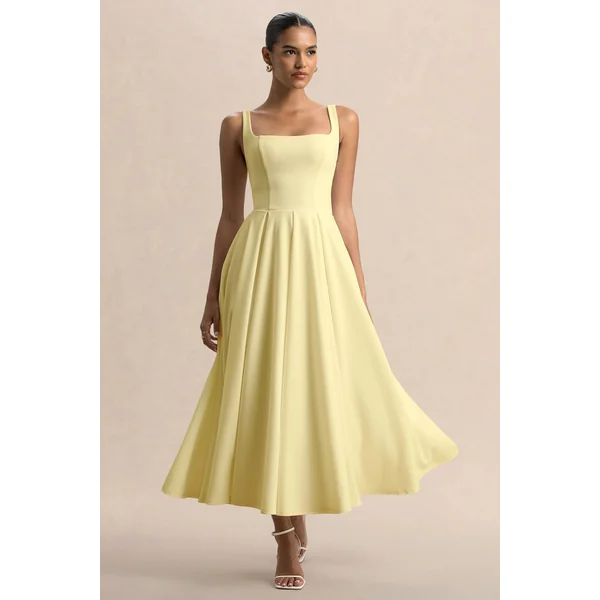 Parina | Robe mi-longue citron à bretelles avec ourlet volumineux