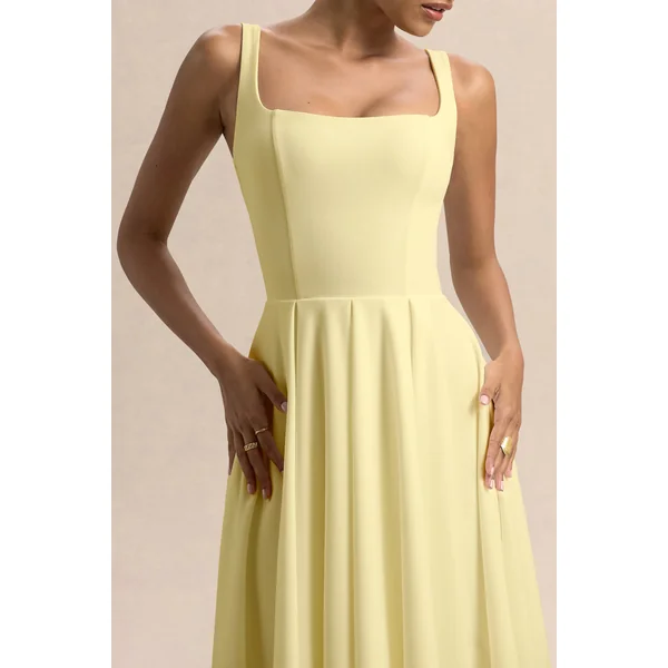 Parina | Robe mi-longue citron à bretelles avec ourlet volumineux