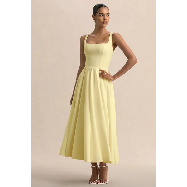 Parina | Robe mi-longue citron à bretelles avec ourlet volumineux