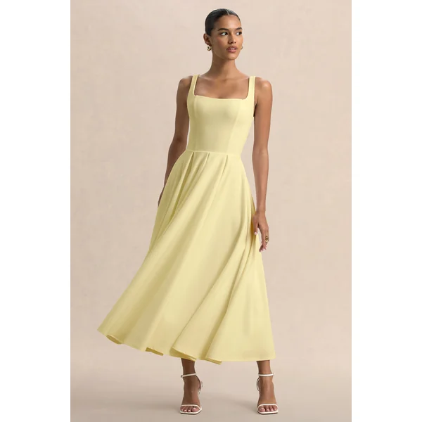 Parina | Robe mi-longue citron à bretelles avec ourlet volumineux