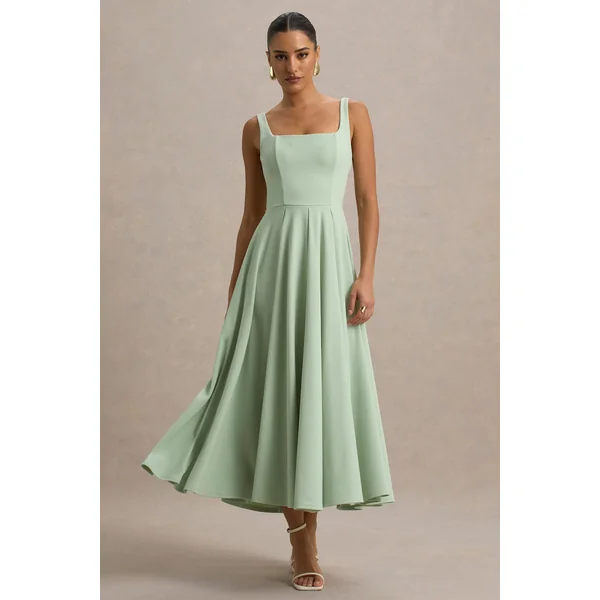 Parina | Robe mi-longue vert clair à bretelles et ourlet volumineux