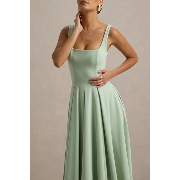 Parina | Robe mi-longue vert clair à bretelles et ourlet volumineux