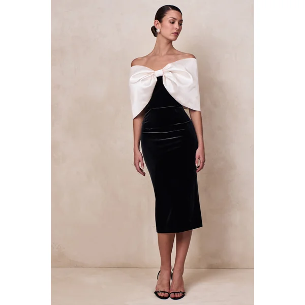 Twilight | Robe mi-longue noire et blanche en velours à décolleté bardot avec grand nœud